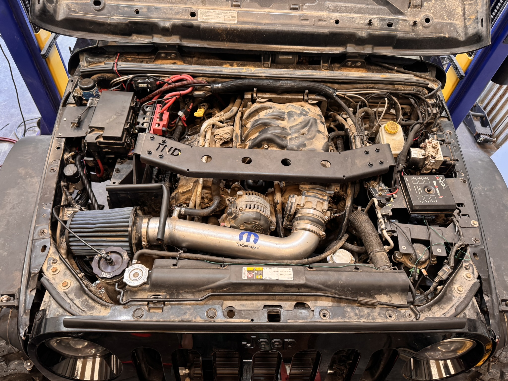 Project Dynamite engine bay showing a fabricated component with a TND cutout