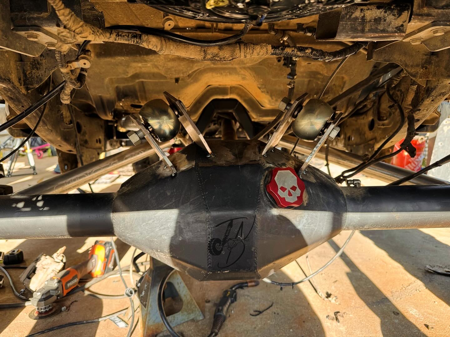 Rear axle showing fabricated suspension link brackets and joints