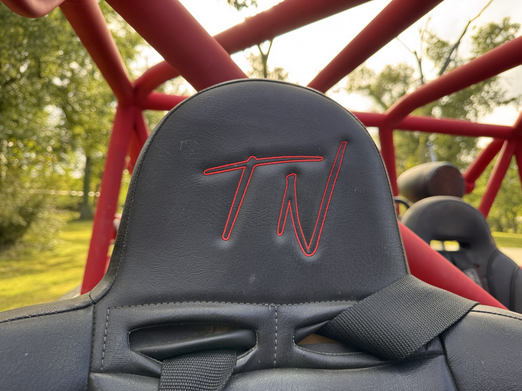 Close view of TND embroidery on a PRP seat with the red cage behind it